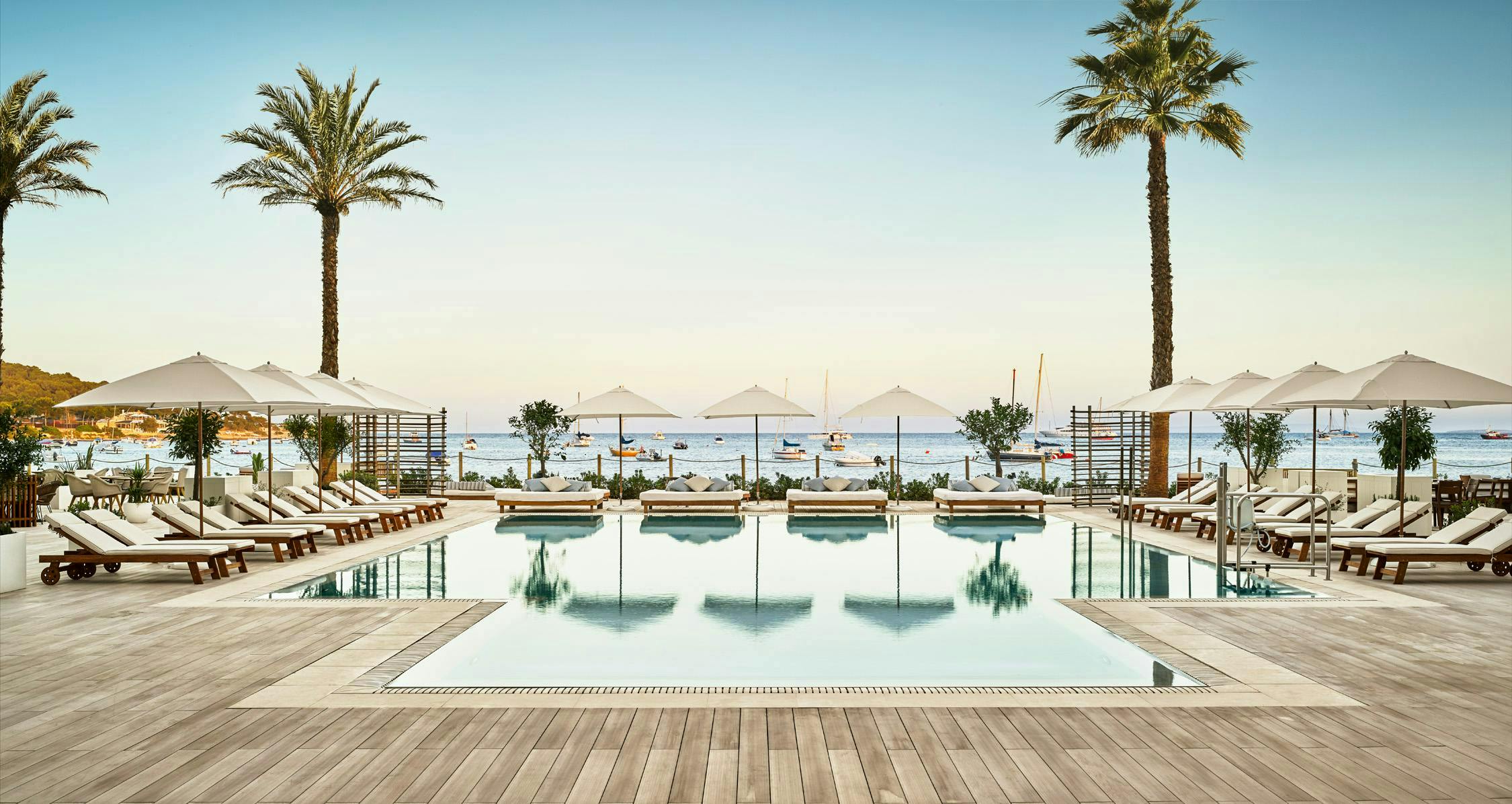 pool water hotel building resort palm tree plant arecaceae tree swimming pool